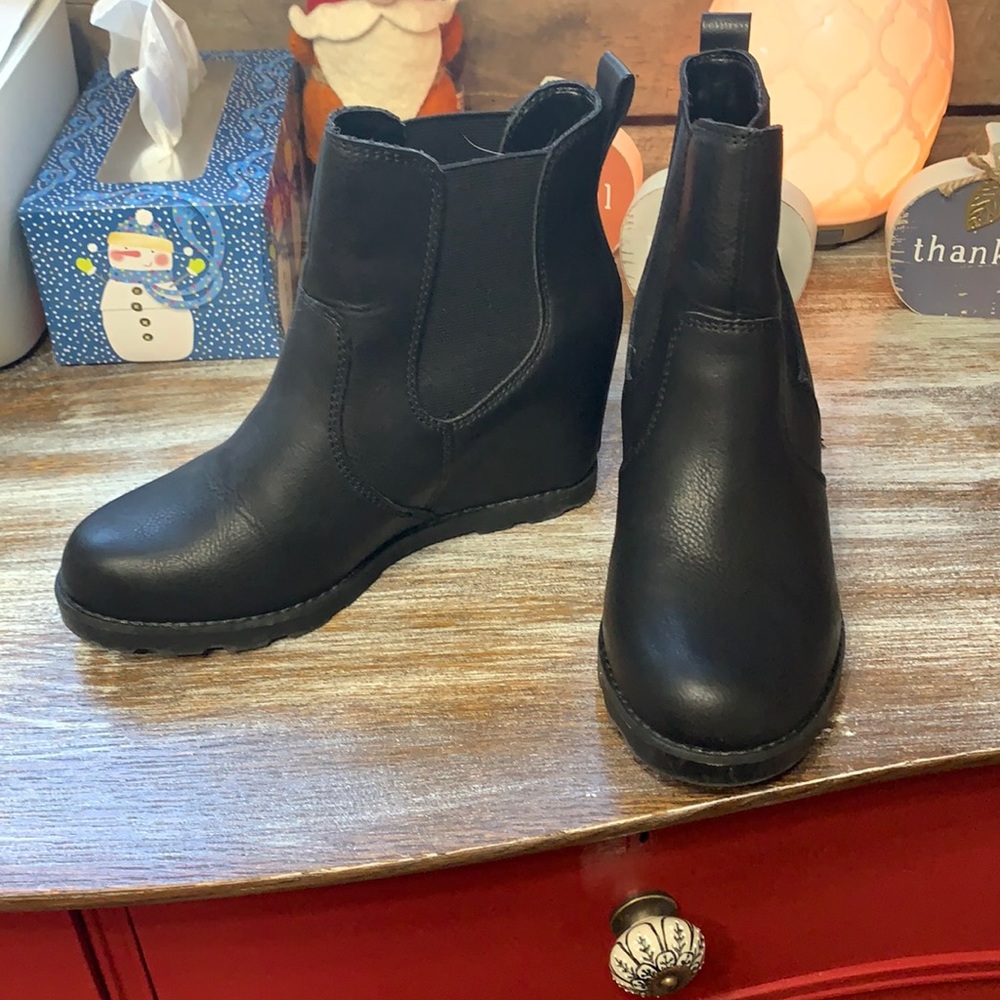 Woman’s black booties